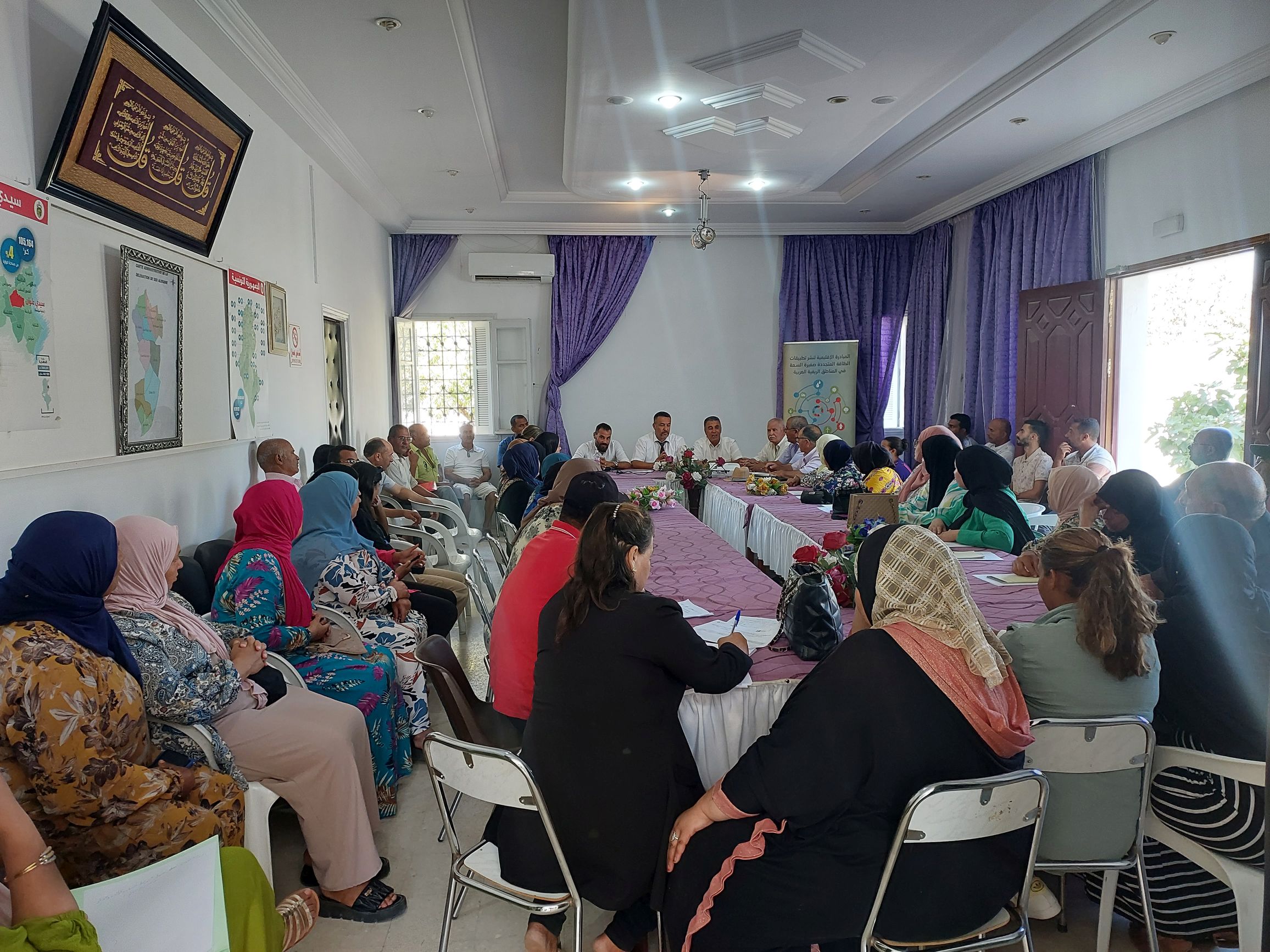 Attendees listening to a speaker